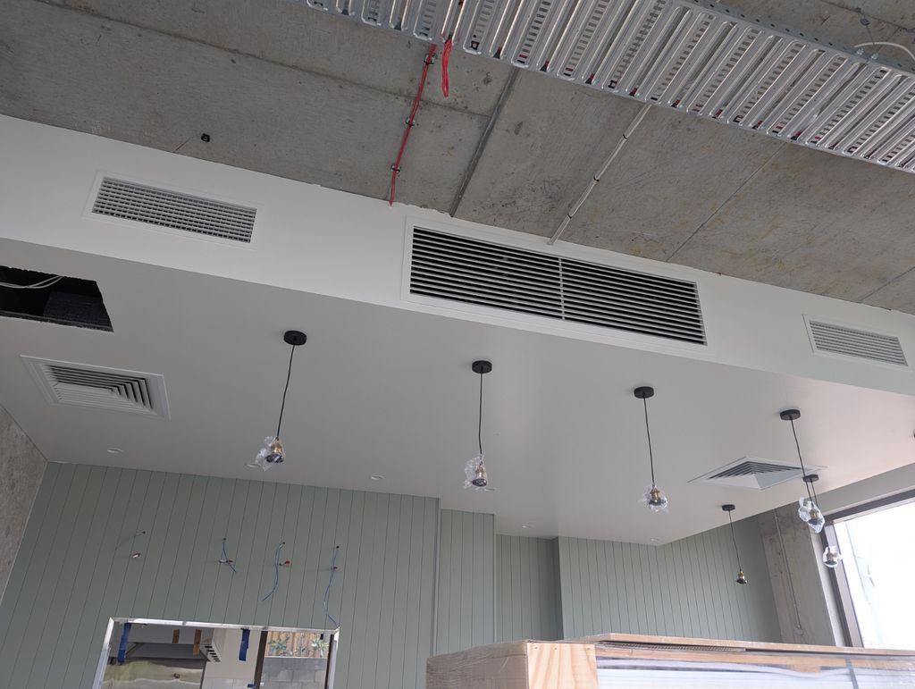 ClimateLink crew installing a ducted air conditioning system in a Queensland home